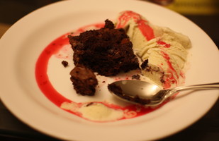 Chocolate-chip Butterscotch Brownie with Raspberry Sauce and Vanilla Bean Ice Cream