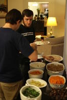 Alex and Mike Serving Dinner