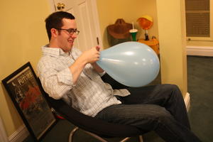 Michael Tying a Balloon