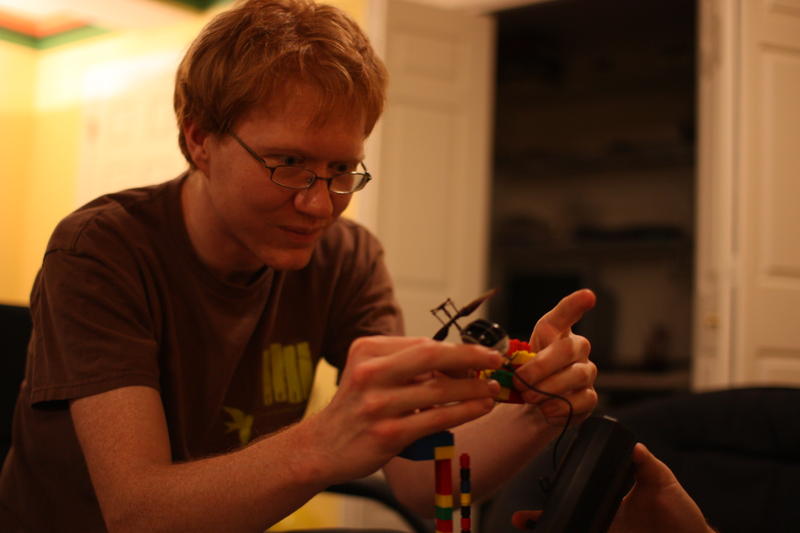 Matt Reassembling Blocks and Holding a Charing Helicopter