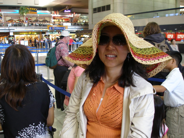 Claudia with hat on the way to Korea