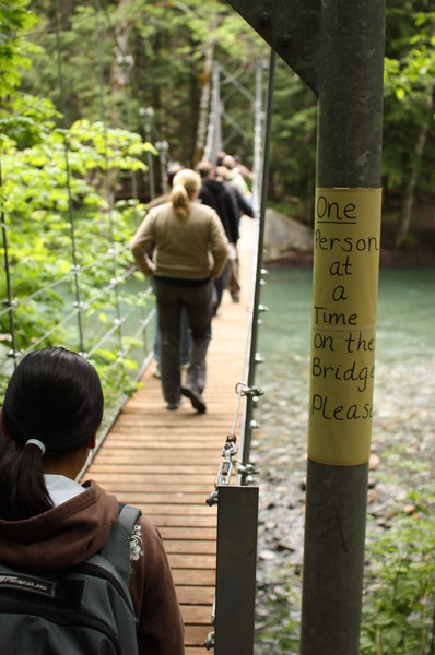 Sign: "*One* Person at a Time on the Bridge Please"